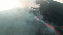 Drone aerial shot of lava flowing from Pacaya volcano eruption in Guatemala.