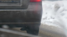 Bumper-to-bumper traffic on a snowy road. 