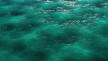 Water Surface Of Turquoise Green Sea In Seamless Loop. CGI