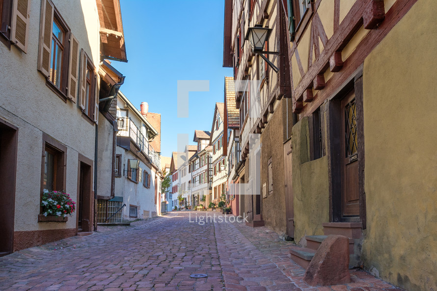 narrow cobblestone street in a village 