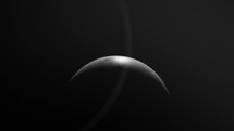 Zoom Out On Crescent Moon In Dark Sky.	