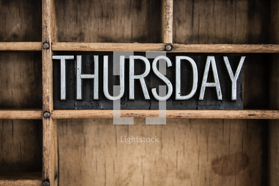 word Thursday in blocks on a shelf 