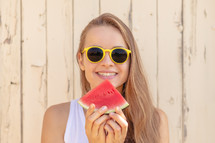 young woman eating watermelon 