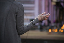 woman with raised hands in worship 