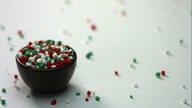 slow motion candy spilling from a bowl 