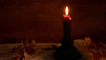 a candle stick with a wood background