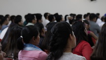 Nepali Christians in Dubai listen to a Christian pastor preaching the bible and teaching in church on Sunday morning.