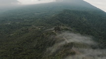 Aerial View On Guatemalan Highlands Surrounded With Lush Vegetation During Sunrise - drone shot	