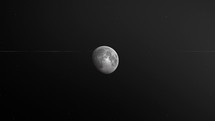 Waxing Gibbous Moon In Black Starry Backdrop. Monochrome. zoom-in	
