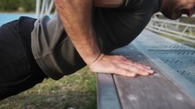 Athlete Does Push Ups In The Stands In The Basketball Court