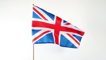 national flag of the United Kingdom (UK) aka Union Jack waving in the wind