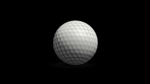 Golf ball rolls toward the camera and stops. Luma key.
