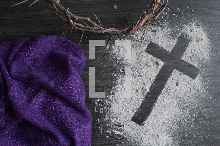 Lent background of ashes cross, crown of thorns and purple cloth