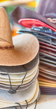 Stacks of cowboy hats.
