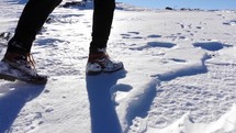 man hiking in snow 