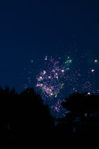 fireworks bursting in the night sky 