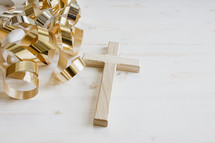 gold streamers and cross on a white background
