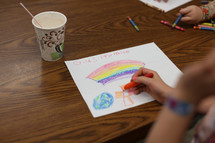 Child coloring religious artwork 