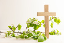 Cross with branch with white flower blossoms