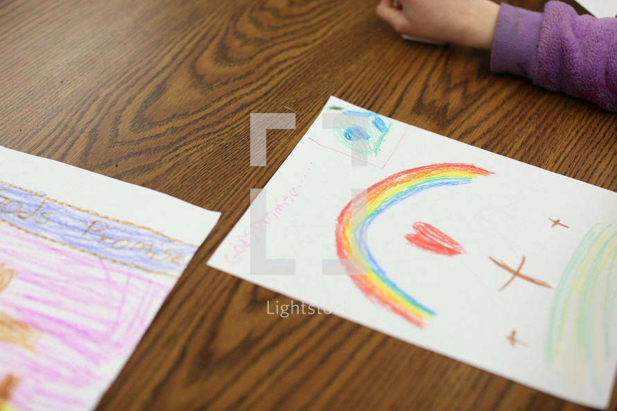 a child coloring religious artwork 