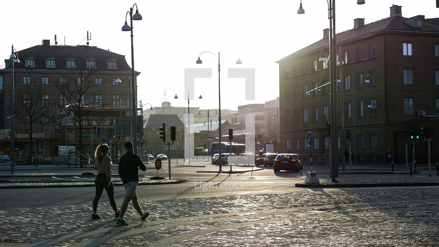 pedestrians on a cobblestone sidewalk in Sweden 