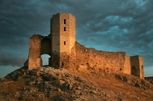 Fortress on the mountain during the storm. Biblical concept of the tower of escape.
