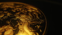 Gold coin with dragon symbol