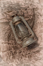 antique lantern on rock 