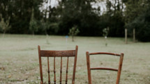 wood chairs in the grass 