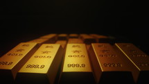 Gold bars are densely arranged on a black background
