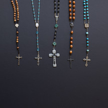 rosaries on a black background 