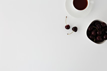 bowl of cherries and coffee cup 