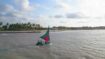 Small fisherman boat sailing at Touros Rio Grande Do Norte Brazil. Beach Front Touros Rio Grande Do Norte. Touros Rio Grande
