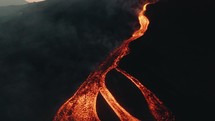 Lava rivers from Pacaya volcano eruption in Guatemala. Drone Aerial Sunrise Shot	