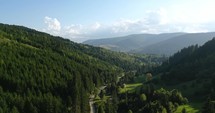 Vista Of Green Conifer Forest Mountains At Palanca In Bacau County, Western Moldavia, Romania. Aerial Drone Shot