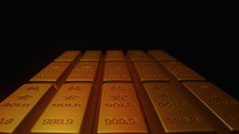 Gold bars are densely arranged on a black background
