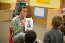 man leading a children's ministry