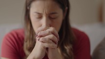 Religious adult woman praying 
