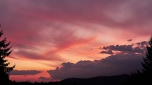 Color clouds at sunset. Time-lapse of colorful, billowing cumulus clouds against an evening sky. 
