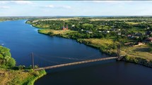 Aerial View of a Suspension Bridge Over a River in Ukraine 4K Drone Shot