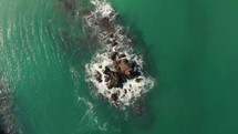 aerial view of rocks in a cove 