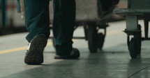 Footsteps of people walking quickly in the train station
