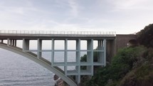 concrete bridge connects two cliffs