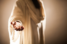 Jesus extending His hand as an invitation to follow Him.