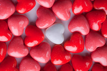 white heart candy and red heart shaped candy