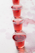 red wine in communion cups 