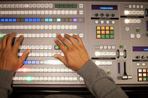 hands on a soundboard 