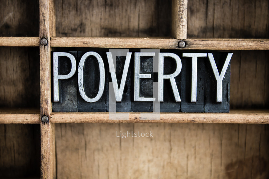 word poverty in blocks on a shelf 