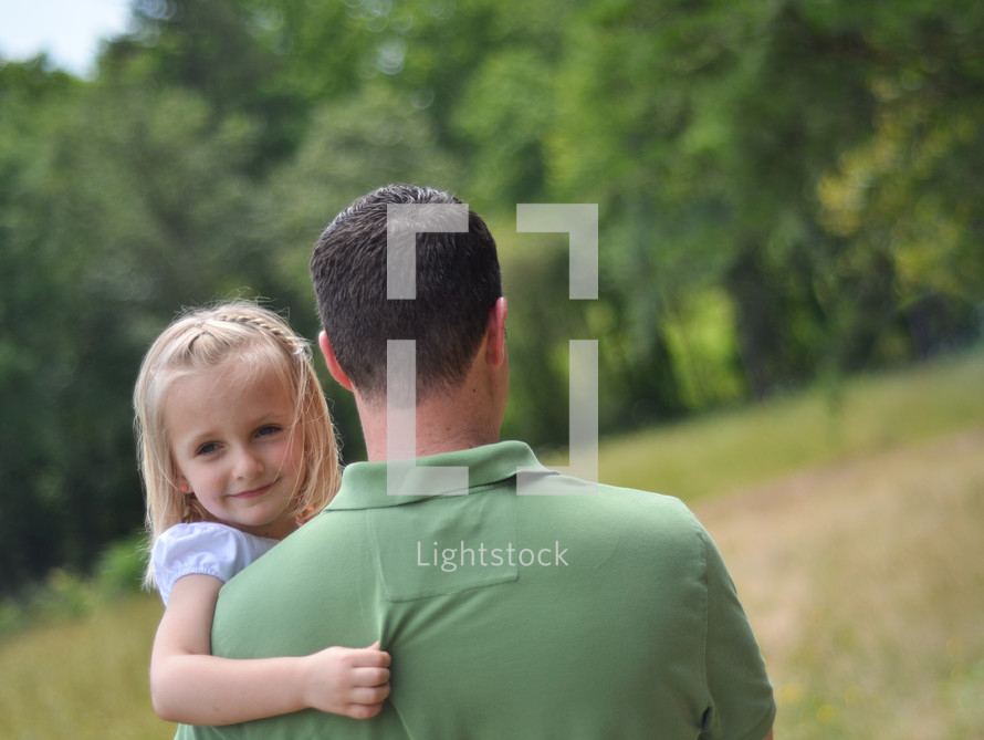 father holding his daughter