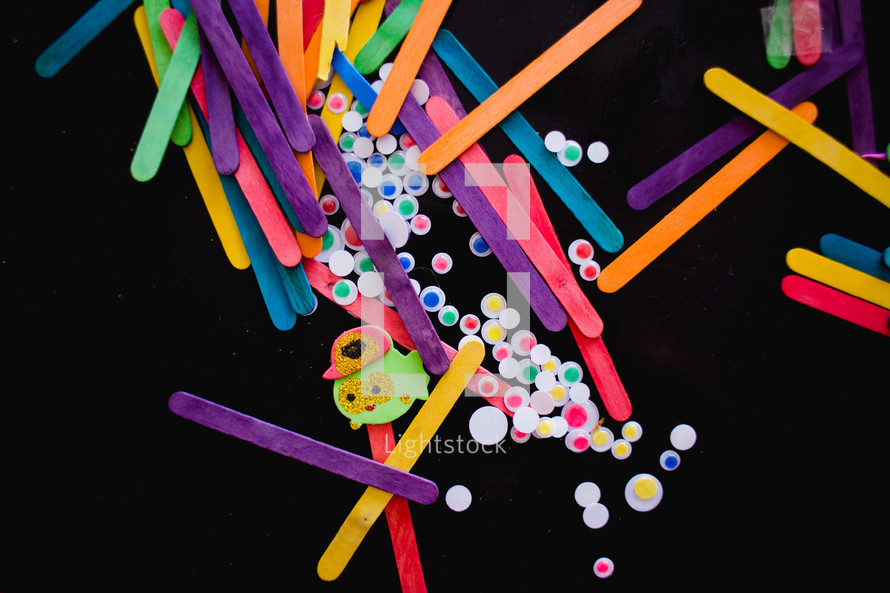 craft materials on a black background 